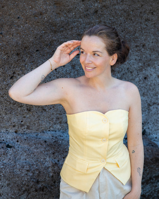 Strapless top met knopen